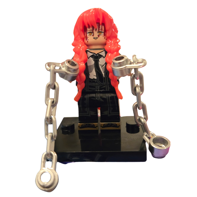 Toy figure with red hair and chains on a white background