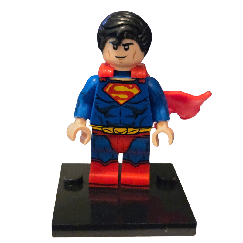 Superman figurine with red cape on a black base against a white background