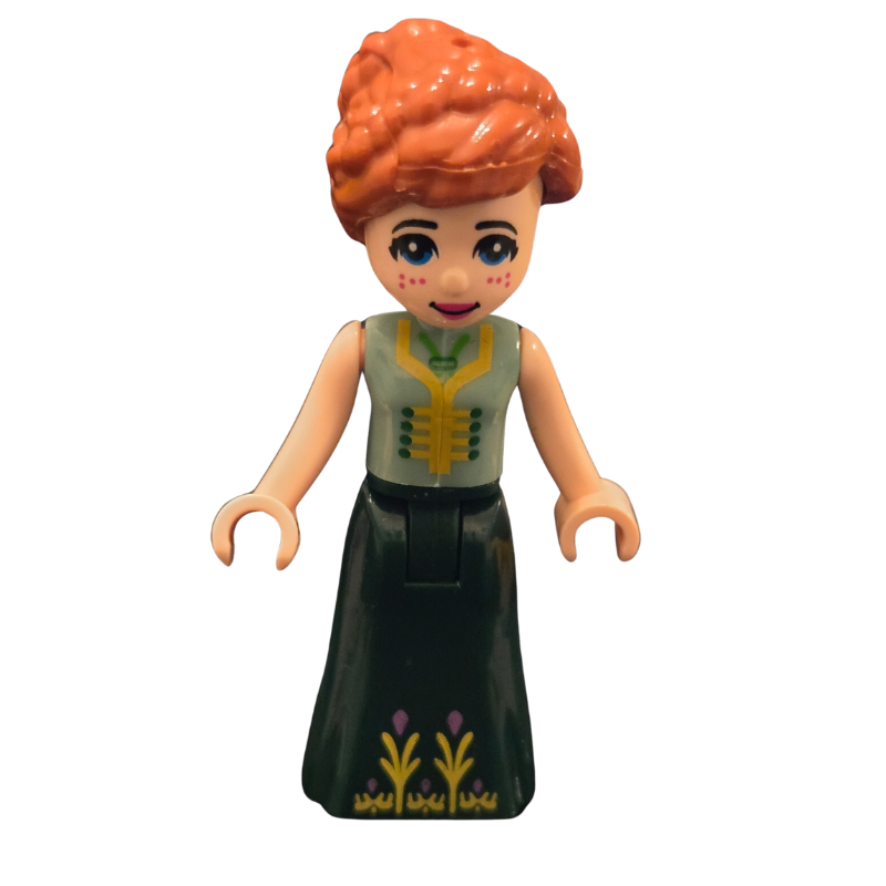 Toy figure with red hair and green dress on a white background