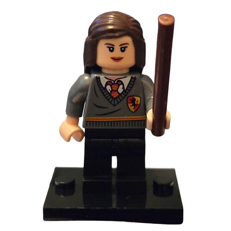 LEGO minifigure of a character wearing a sweater with a school emblem and holding a broomstick on a white background.