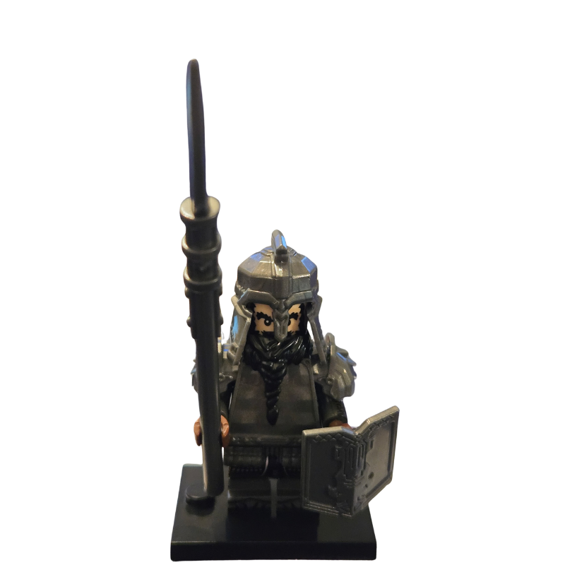 Figurine of a warrior with a spear and shield on a white background
