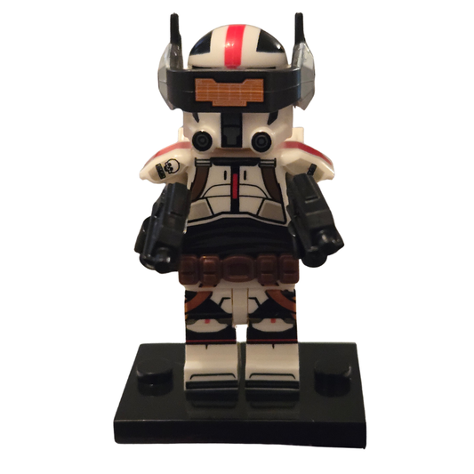 Toy figure on a black stand with a white background