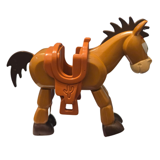 Toy horse figure with an orange saddle on a white background