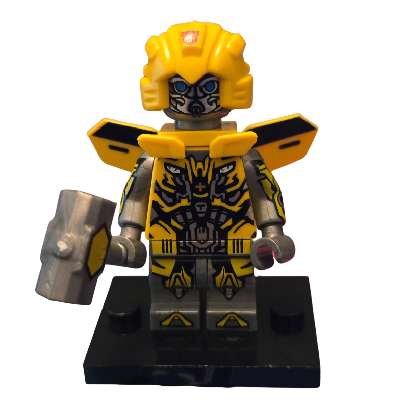 Yellow and black superhero figure with a helmet and cape on a white background