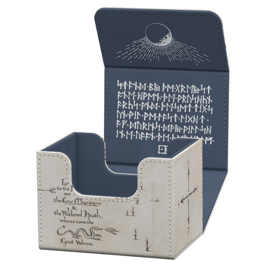 A Magic: The Gathering card box with an open lid, featuring a navy blue interior with white runic symbols and a cream-colored exterior with black script and illustration details.
