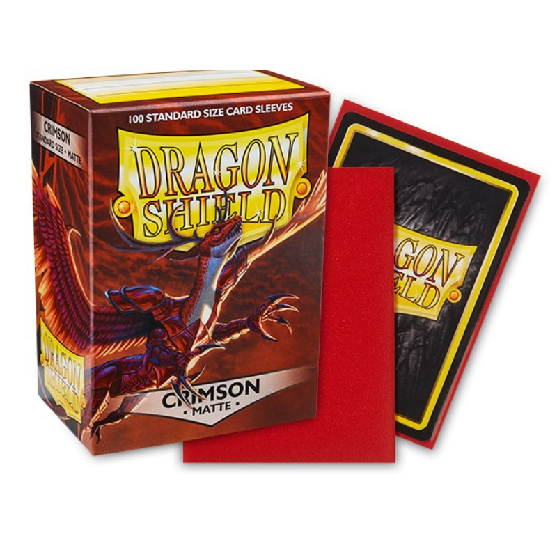 Dragon Shield card sleeves in the Crimson Matte edition, showing the retail box with a red dragon illustration, a red sleeve, and a black sleeve with a yellow Dragon Shield logo.