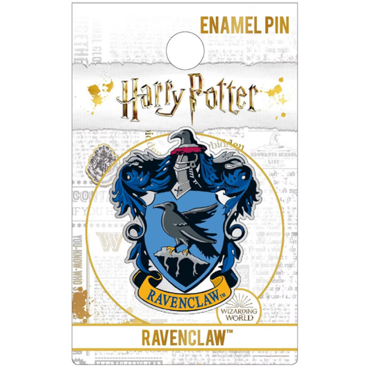 Harry Potter Ravenclaw enamel pin on its original backing card. The pin features the iconic blue and silver Ravenclaw crest with a raven and the word 'RAVENCLAW' on a gold banner, set against a themed white and gold background.