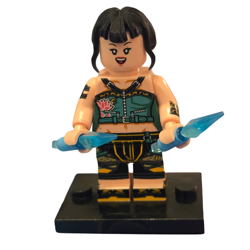 Toy figure with black hair and blue gloves on a white background