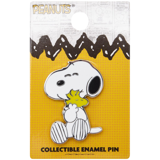 Snoopy collectible enamel pin on its original retail display card. The pin depicts Snoopy sitting and holding Woodstock, set against a yellow background on the card with 'PEANUTS' branding at the top and 'COLLECTIBLE ENAMEL PIN' at the bottom.