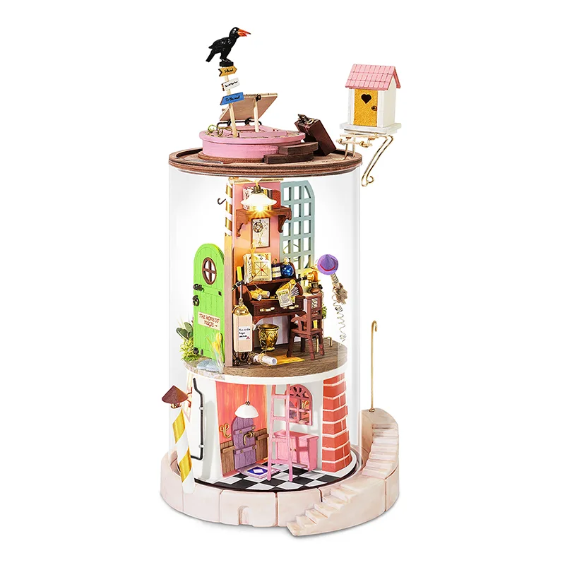 A miniature dollhouse-style tower with a clear cylindrical body, decorated with colorful rooms, tiny figures, a bird perched on top, and a small birdhouse extension on the side, shown on a plain white background.