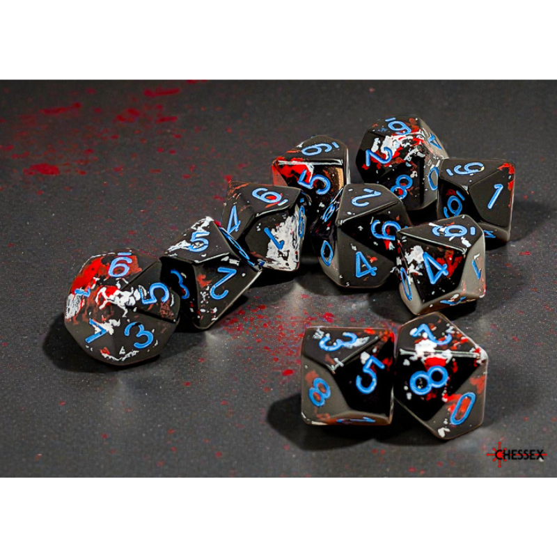 Set of black dice with blue and red numbers on a dark surface