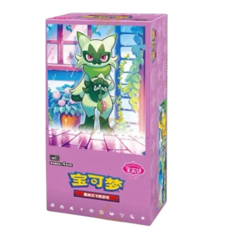 A pink Pokémon card deck box featuring an illustration of a green creature character standing in a colorful room. The box has Chinese text on the front and a Pokémon logo badge on the right side, photographed against a plain white background.
