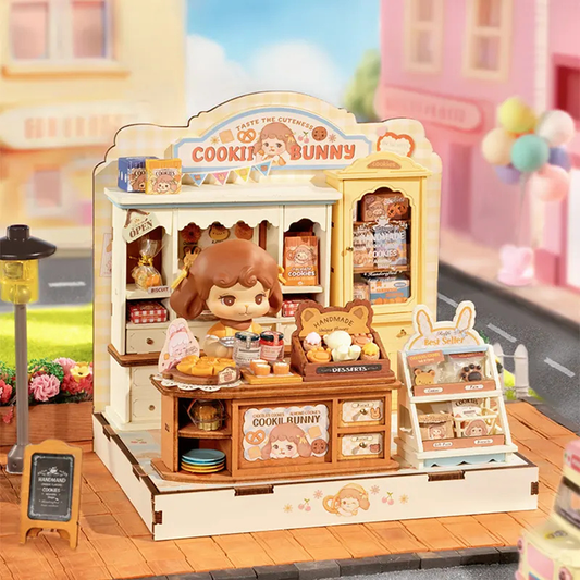 Toy bakery set with 'Cookie Bunny' branding in a colorful miniature town setting.