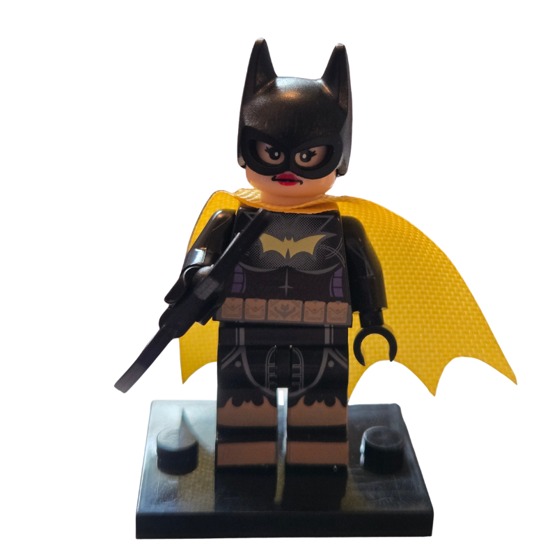 Toy figure of a superhero in black and yellow costume on a white background