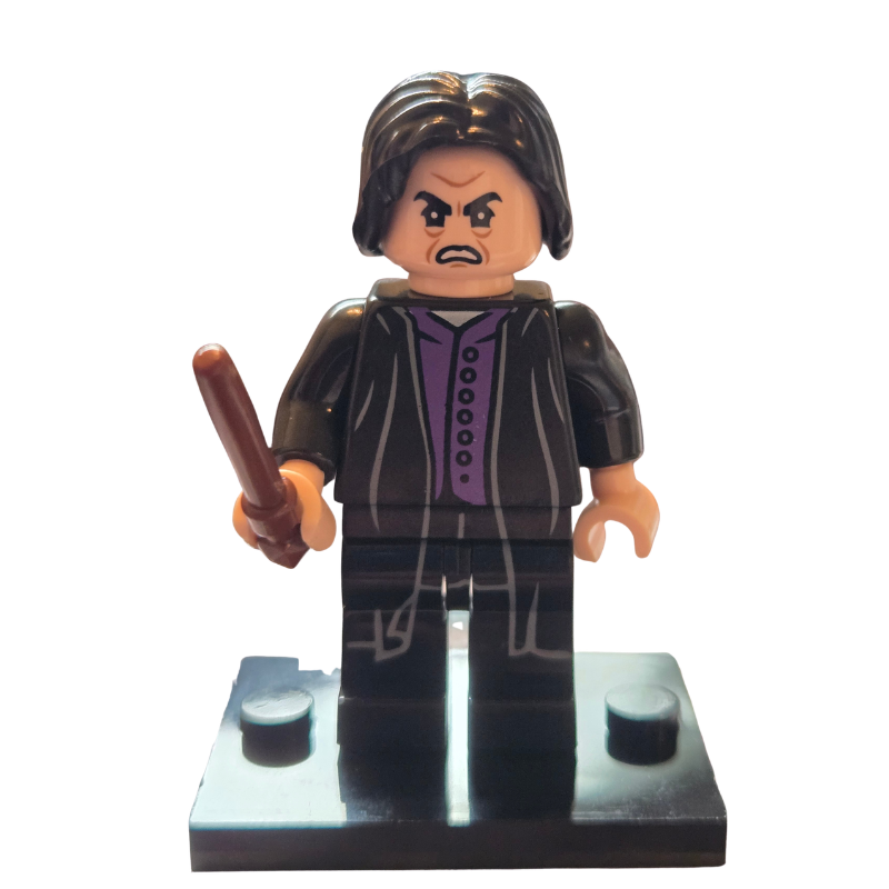 Toy figure with a dark outfit and wand on a white background