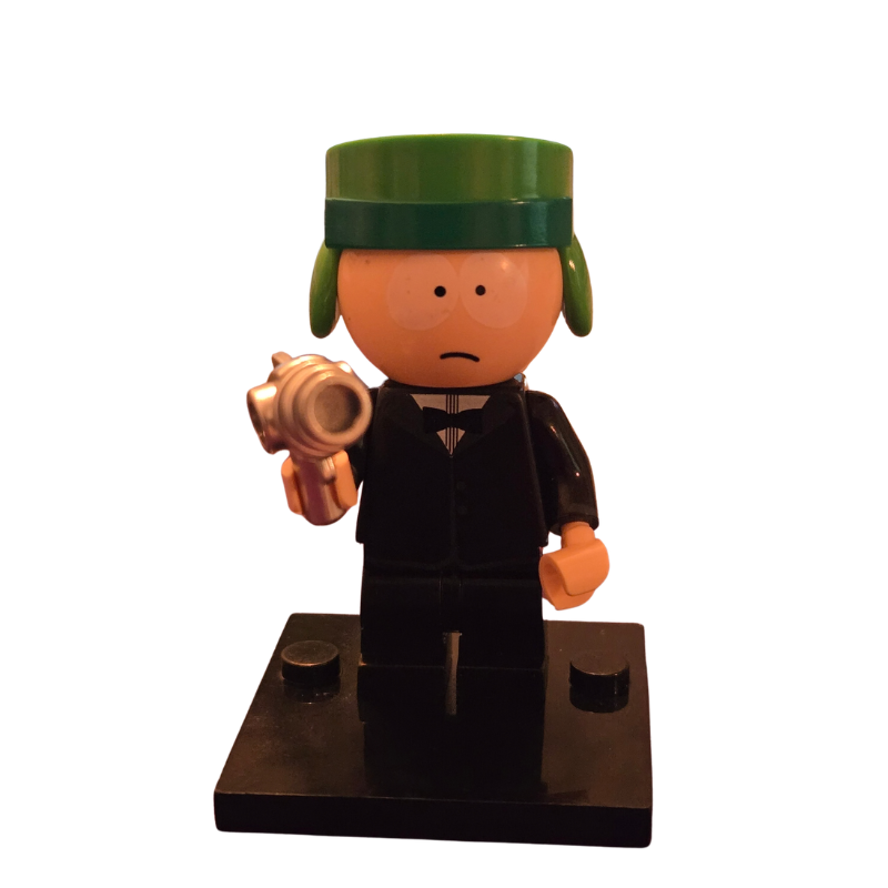 Toy figure with a green hat and black outfit holding a golden object on a white background