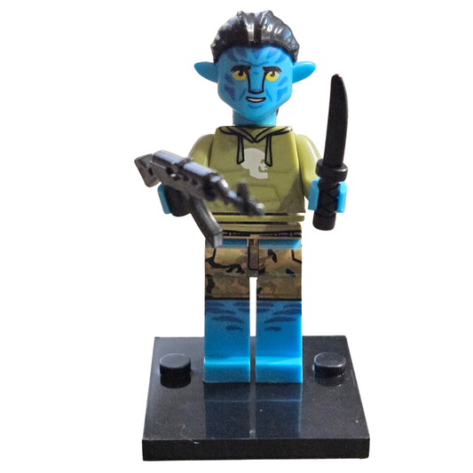 Toy figure with blue skin and yellow shirt holding weapons on a white background