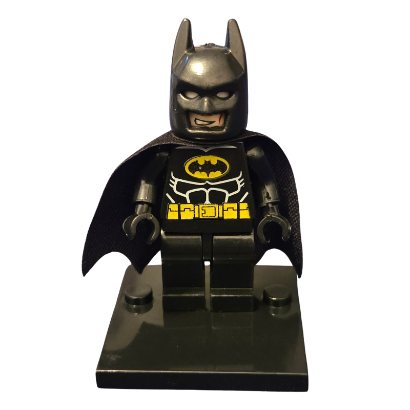 LEGO Batman figure with cape and bat logo on a white background