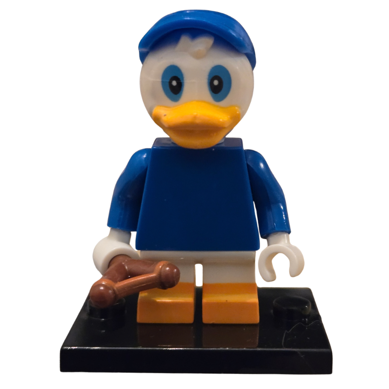 Toy figure of a duck character with a blue outfit on a white background
