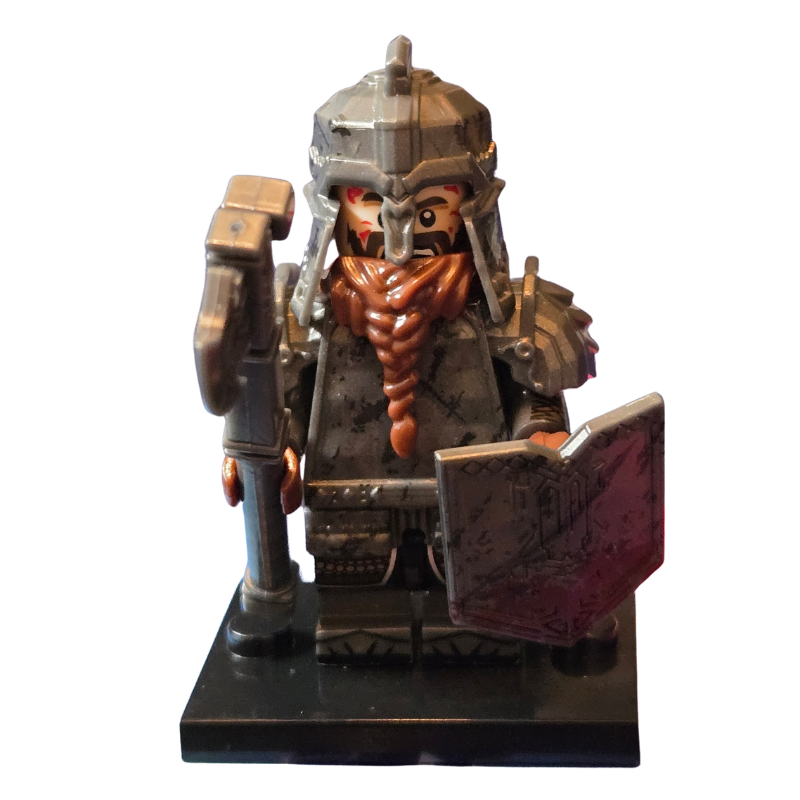 Figurine of a warrior with armor and a weapon on a white background