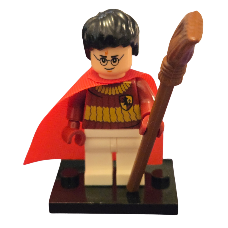 LEGO minifigure of a character with a red cape and broomstick on a white background