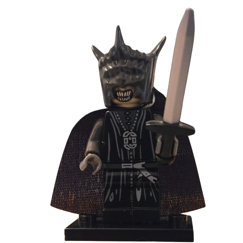 Minifigure with dark costume and mask holding a sword on a white background