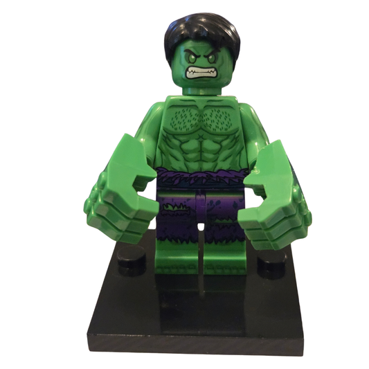 Green superhero figure on a black stand with a white background