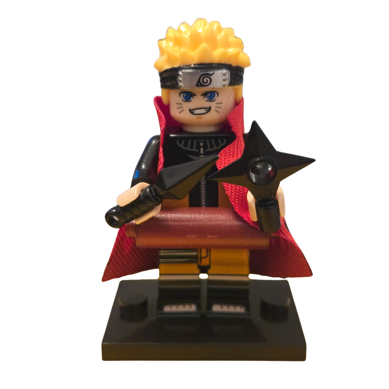 Toy figure with blonde hair and red cape holding a sword and star-shaped object on a white background