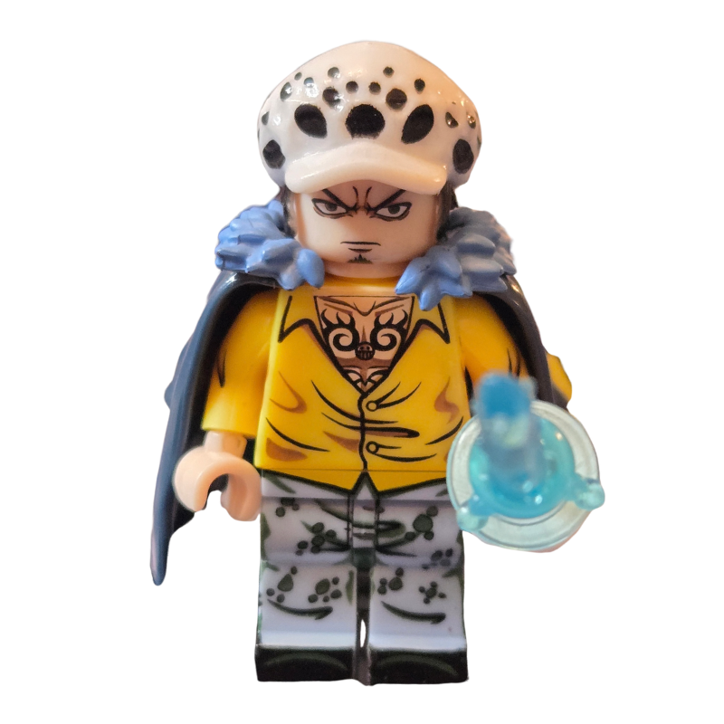 Toy figure with a yellow outfit and blue cape on a white background