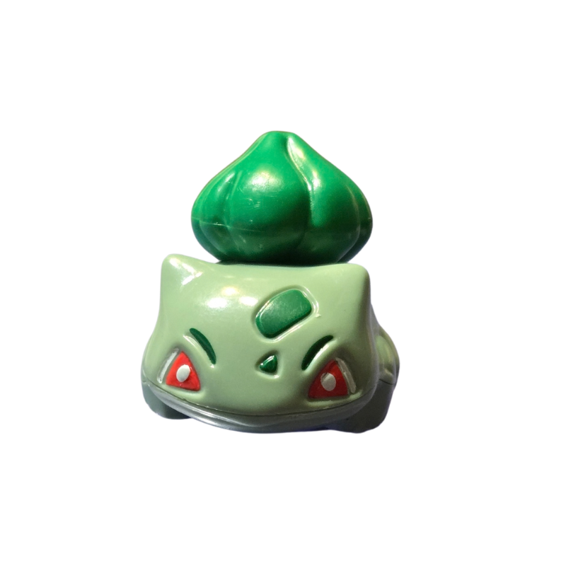 Green and red character figurine on a white background