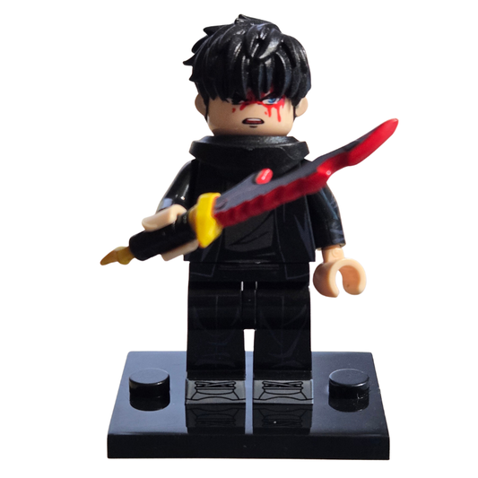 Toy figure with black hair and a red weapon on a white background