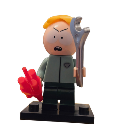Toy figure holding a wrench and showing a middle finger on a white background