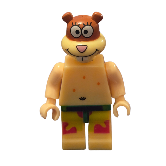 Toy figure of a character with a yellow body and brown head on a white background