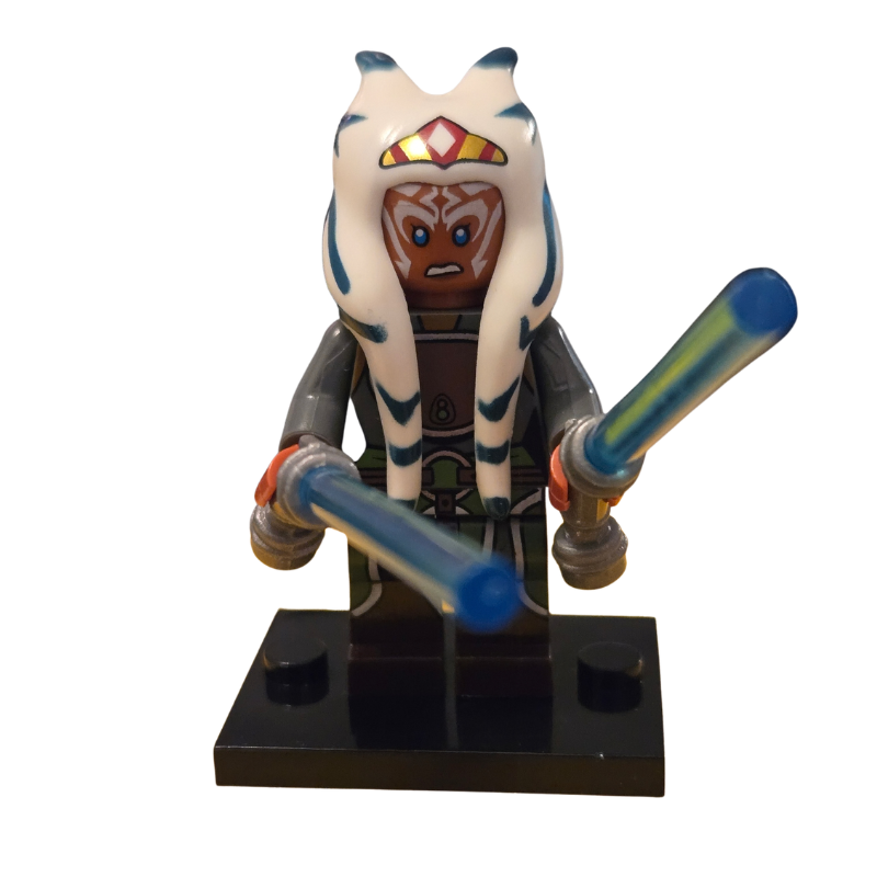 Toy figure with long white hair and blue lightsabers on a white background