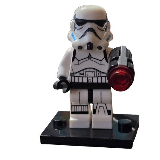 LEGO stormtrooper figure with a red weapon on a white background