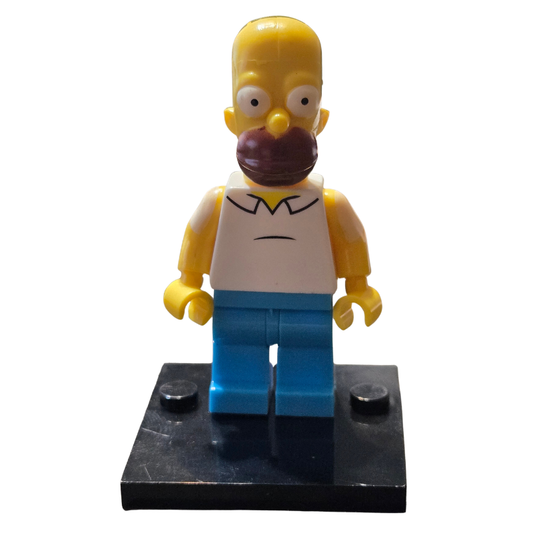 Toy figure of a character from 'The Simpsons' on a white background
