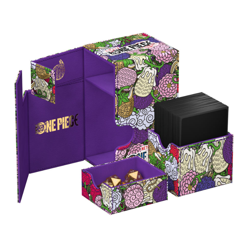 A One Piece themed card deck box set with a purple interior and a multicolor fruit-patterned exterior, shown open with a deck of black cards and small accessory boxes on a white background.