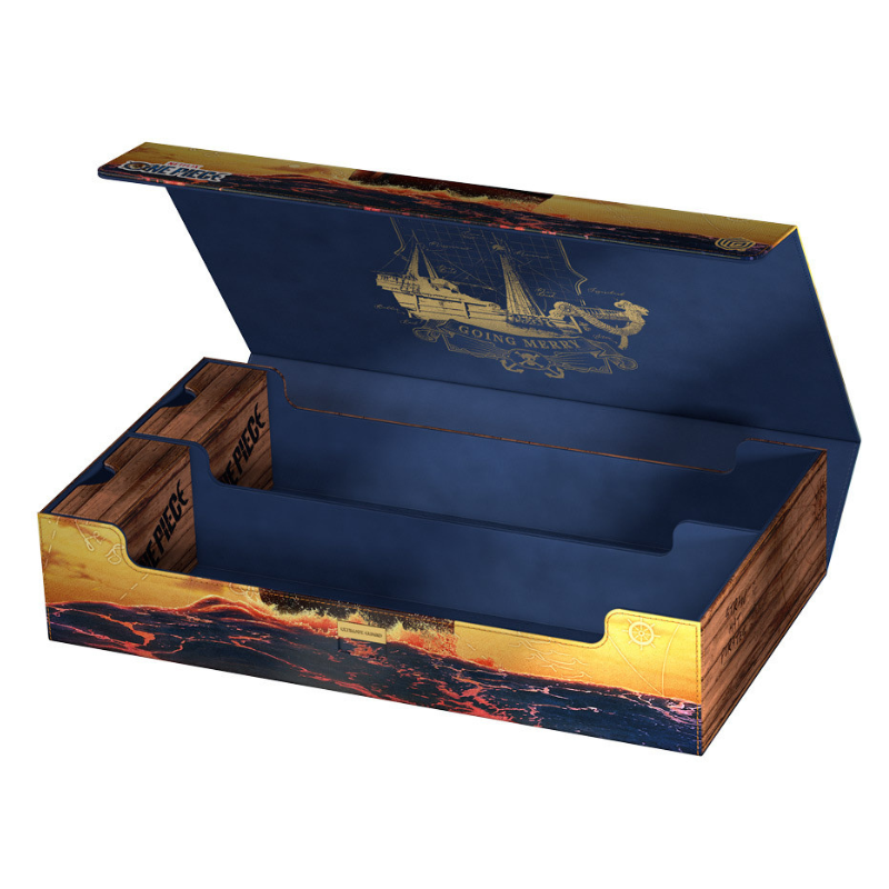 An open decorative storage box or game box with a navy blue interior, gold ship illustration on the lid, and a printed lava-boat style design on the exterior. The box is shown on a plain white background.