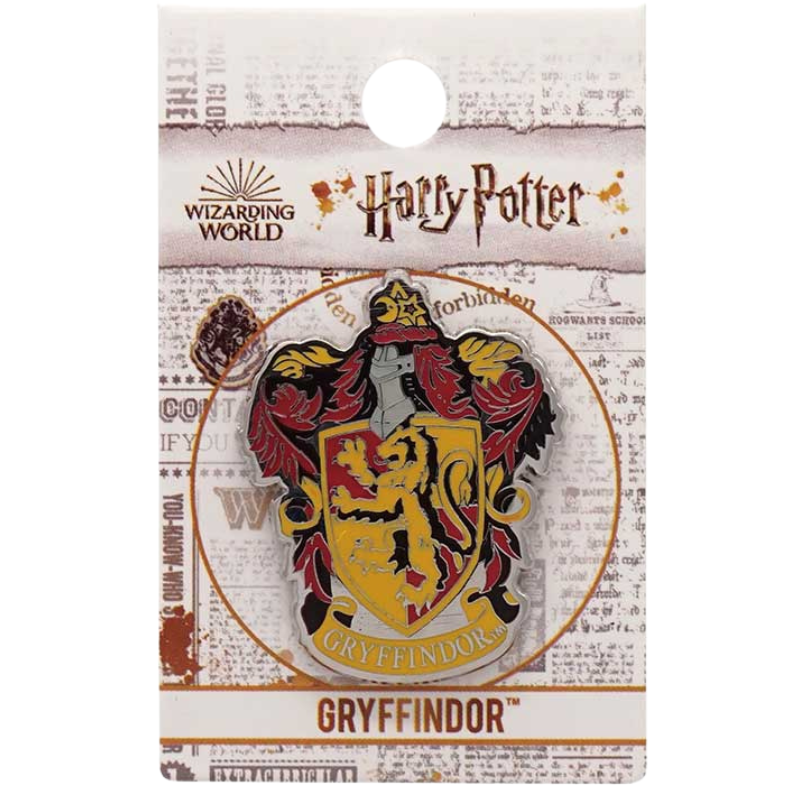 A Harry Potter Gryffindor enamel pin displayed on its branded backing card. The pin features the Gryffindor house crest with a red lion on a yellow shield, surrounded by red and gold feathers, and is labeled 'Gryffindor'.