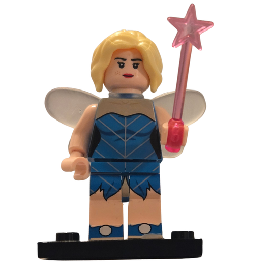 Toy figure with fairy wings and a pink wand on a white background