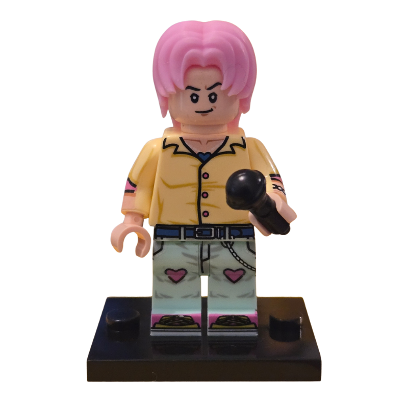 Toy figure with pink hair and yellow shirt on a white background