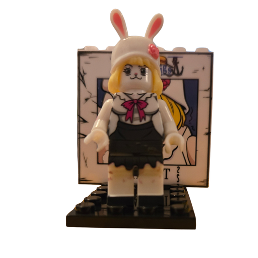 Toy figure of a character in a bunny costume with a stand featuring a similar design.