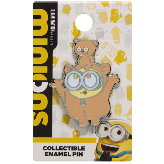 A collectible enamel pin of a Minions character on its original retail blister card packaging. The pin features a brown minion with goggles and a smaller minion character on its head.