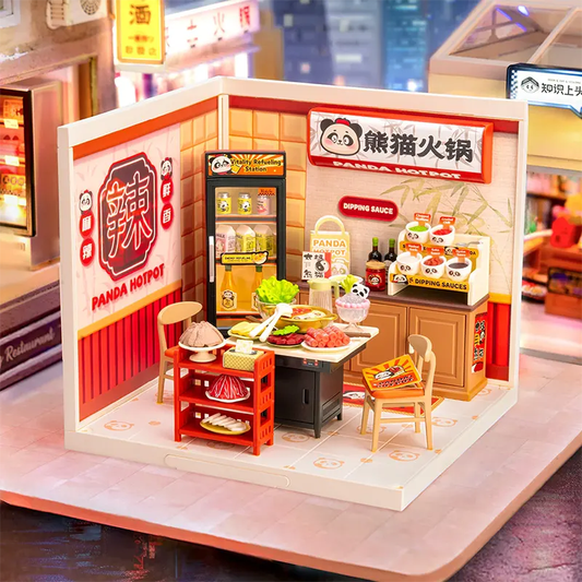 Miniature model of a Panda Hotpot restaurant with various food items and decor.
