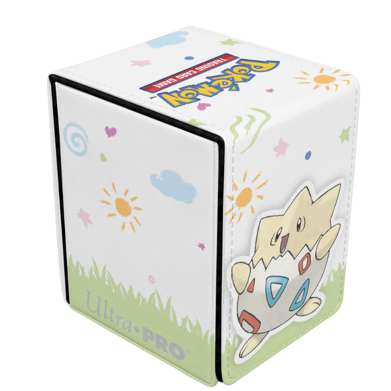 A Pokémon Ultra PRO display box featuring a white background decorated with colorful suns, clouds, stars, and grass, with a character sticker on the front-right side.